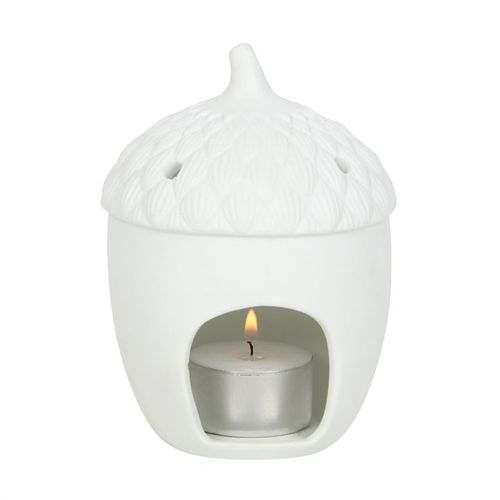Acorn Tealight Holder with candle, nature-inspired décor piece.
