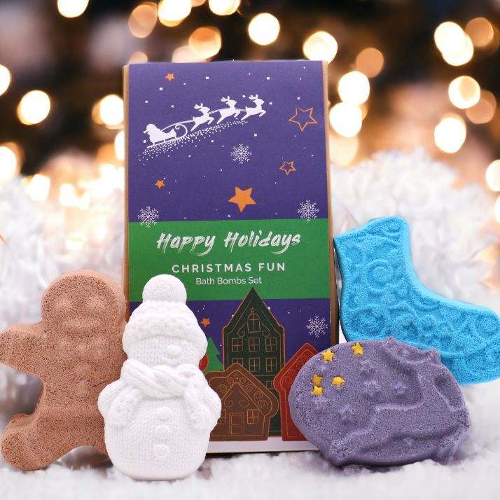 Christmas Fun Bath Bomb Gift Pack with gingerbread, snowman, ice skate, and reindeer shaped bath bombs in festive packaging