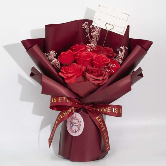 Large red soap roses bouquet wrapped in wine paper with Love is Eternal ribbon and gift card