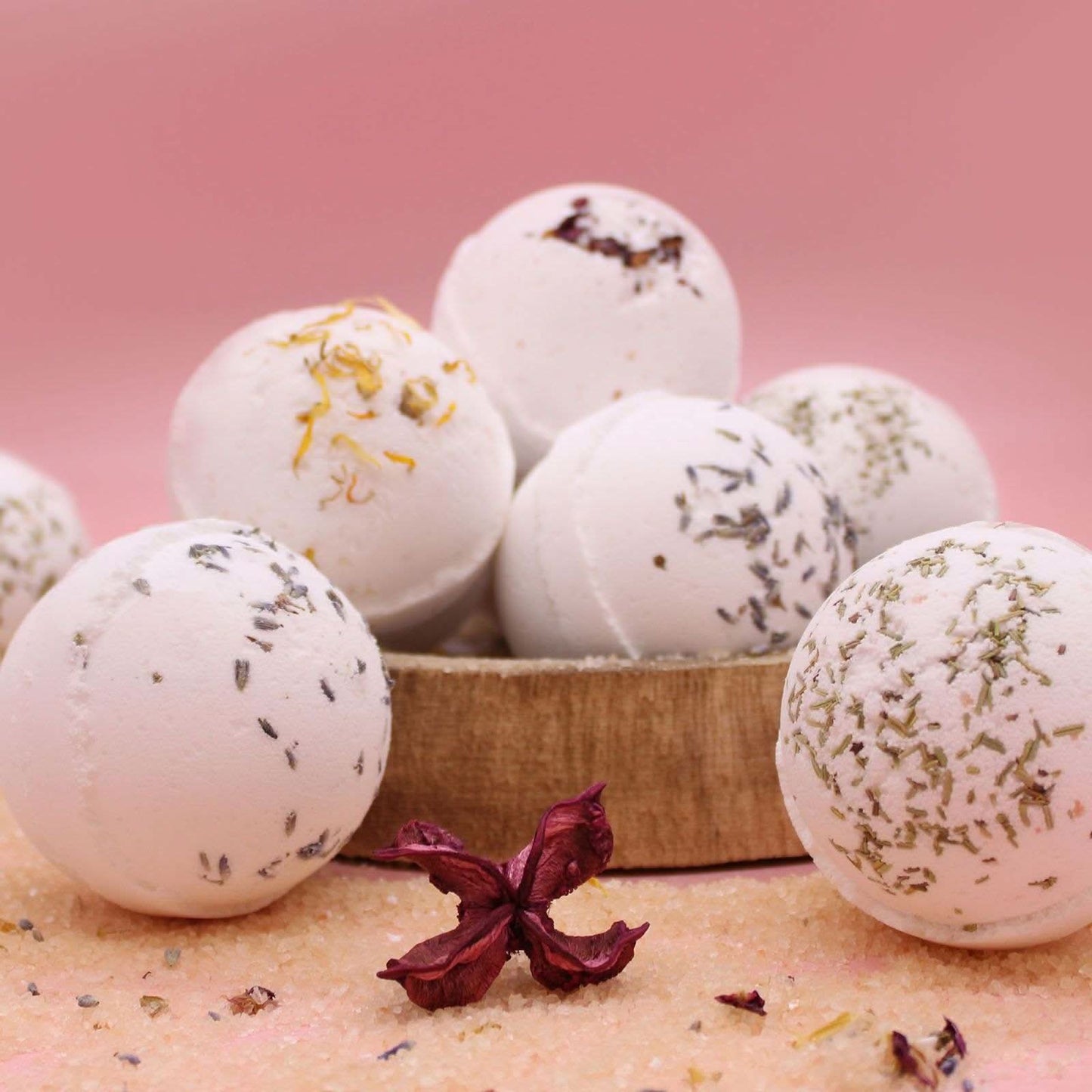 Detox Himalayan Salt Bath Bombs with tea tree, lime, and evening primrose oil on pink background