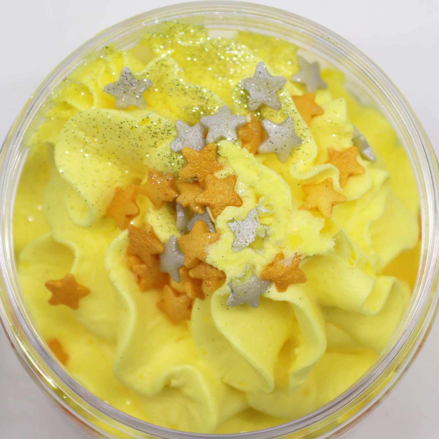 Cosy Winter Nights whipped soap with yellow cream, silver and gold star sprinkles, and shimmering glitter in 120g jar