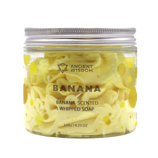 Banana Whipped Soap in a clear jar, pale yellow whipped texture with banana-themed label and 120g contents