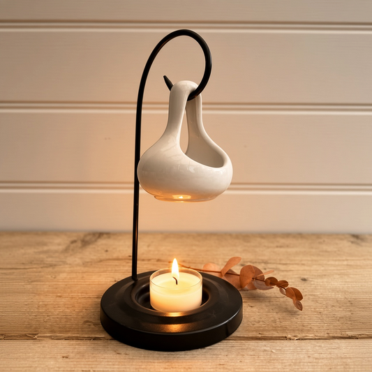 beautiful 2-piece hanging tear-shaped ceramic burner in glossy white ceramic with a black metal stand and candle base