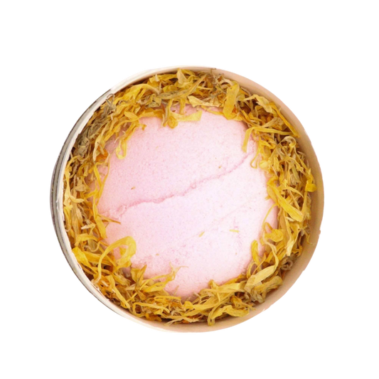 Blooming Pink Bliss Aromatherapy Bath Collection with pink bath bomb and yellow marigold petals