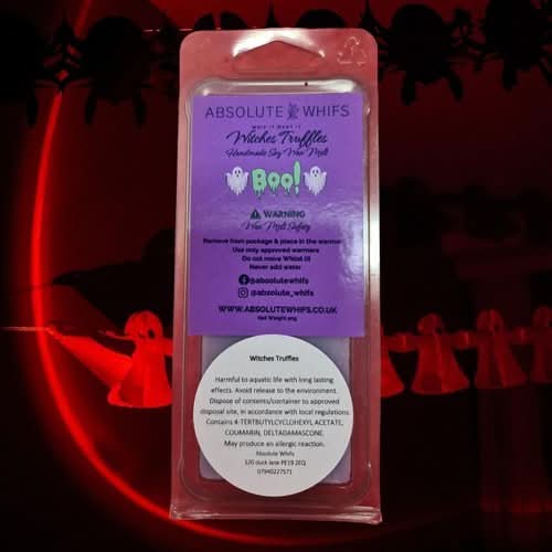 Colorful purple and green Halloween-themed "Boo Witches Truffles" clamshell wax melt, offering rich cocoa, vanilla, and enchanting scents.