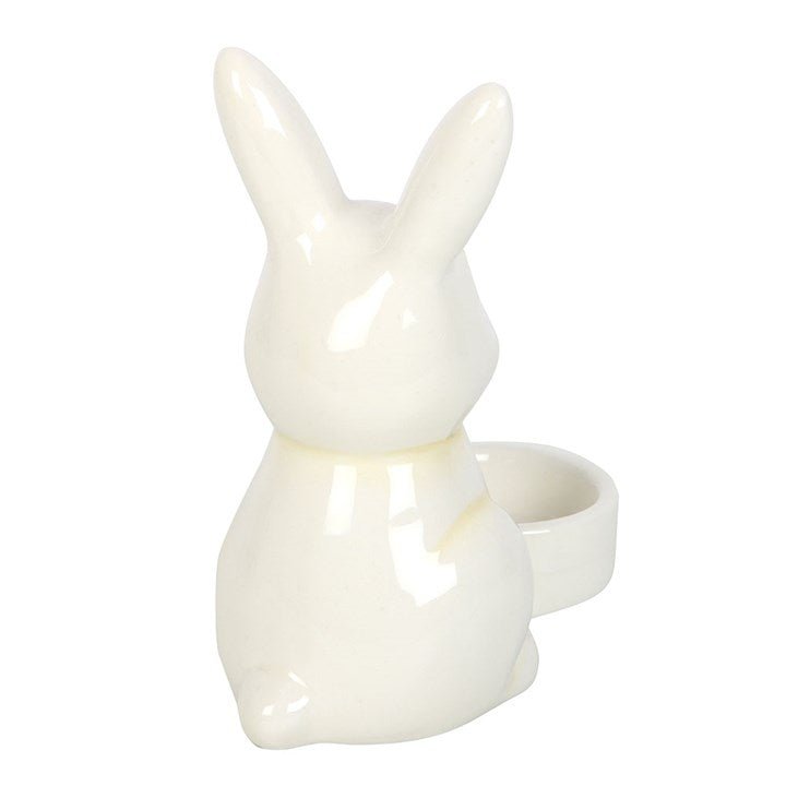 Ceramic bunny-shaped tealight holder for Easter decor.