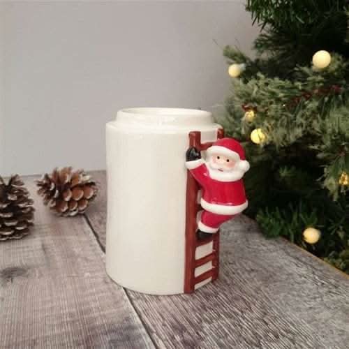 Climbing Santa Wax Burner holiday decoration with Santa figurine and festive lights