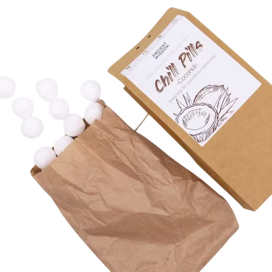 Coconut Chill Pills Gift Pack in brown paper packaging with white coconut-scented bath pills and illustrated label