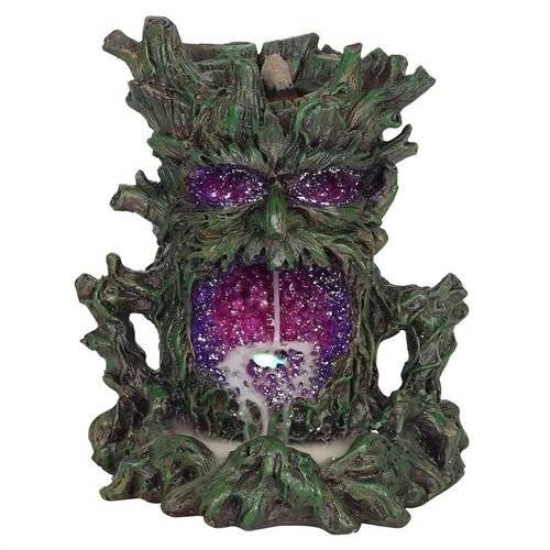 Dark Tree Man Backflow Incense Burner with light and intricate design.