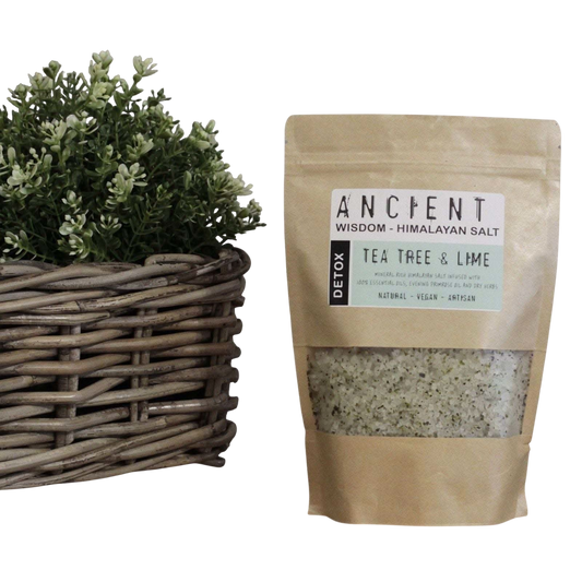 Detox Himalayan Bath Salt in a kraft pouch with visible tea tree and lime label and herb-speckled salt blend