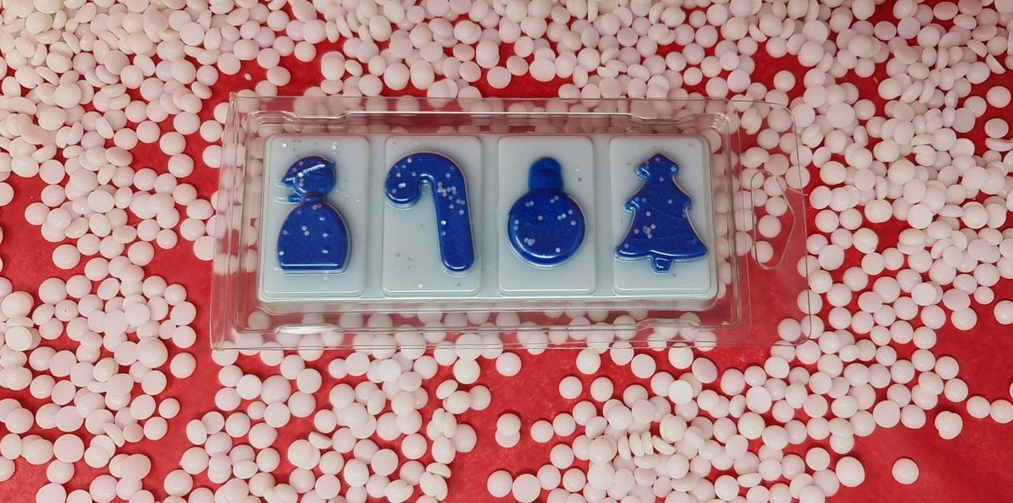 Festive Snuggles wax melt snap bar with winter-themed designs on a red and white background.