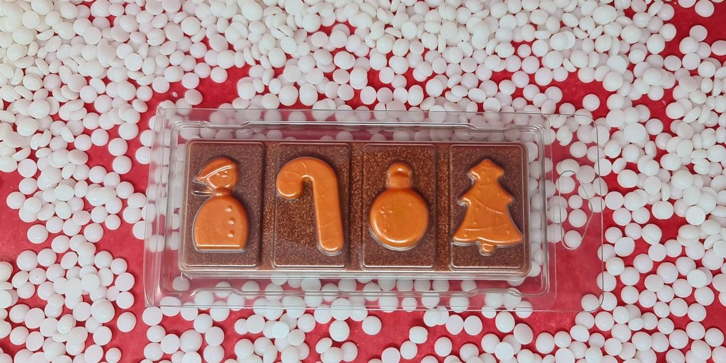 Gingerbread wax melt snap bar with holiday shapes on a colorful background.