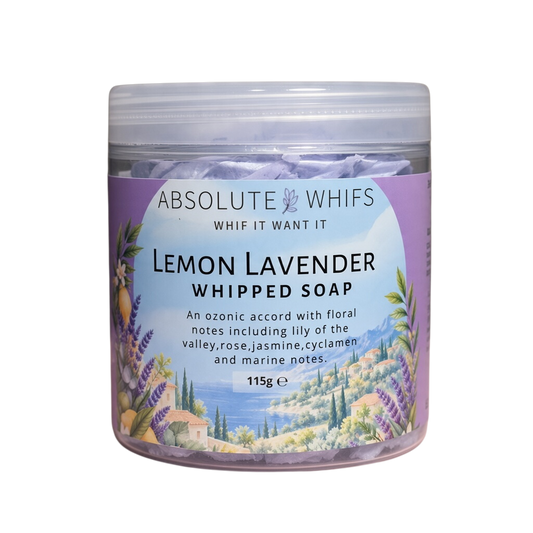 Lemon Lavender Whipped Soap in a clear plastic jar with a lavender and pale blue scenic floral label and white lid.
