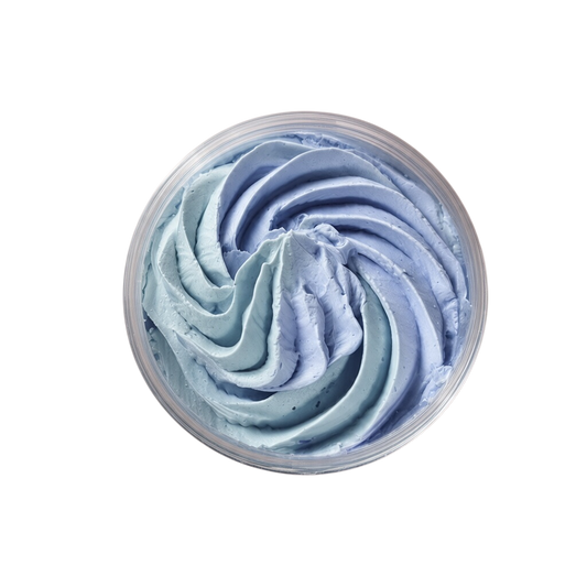 Lemon Lavender Whipped Soap in pale blue and lavender cream, piped into a soft, airy swirl inside a clear jar