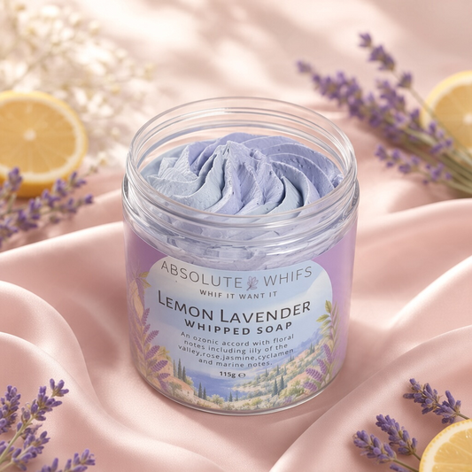 Lemon Lavender Whipped Soap in a clear plastic jar, pale lavender whipped texture with a floral label and lemon accents.