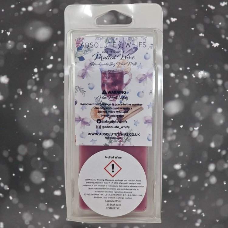 Mulled Wine Wax Melt Snap Bar in packaging against a snowy backdrop.