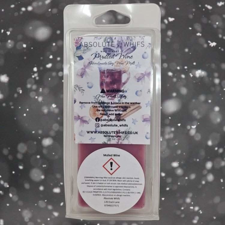 Mulled Wine Wax Melt Snap Bar in packaging against a snowy backdrop.
