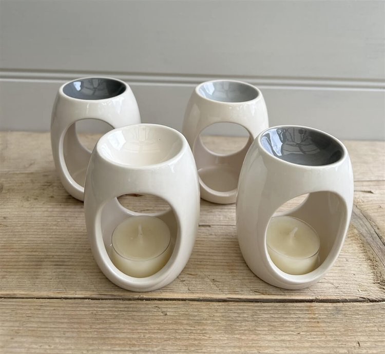 Oval Ceramic Oil and Wax Warmer in four assorted colors with a painted top, elegantly designed for home décor.