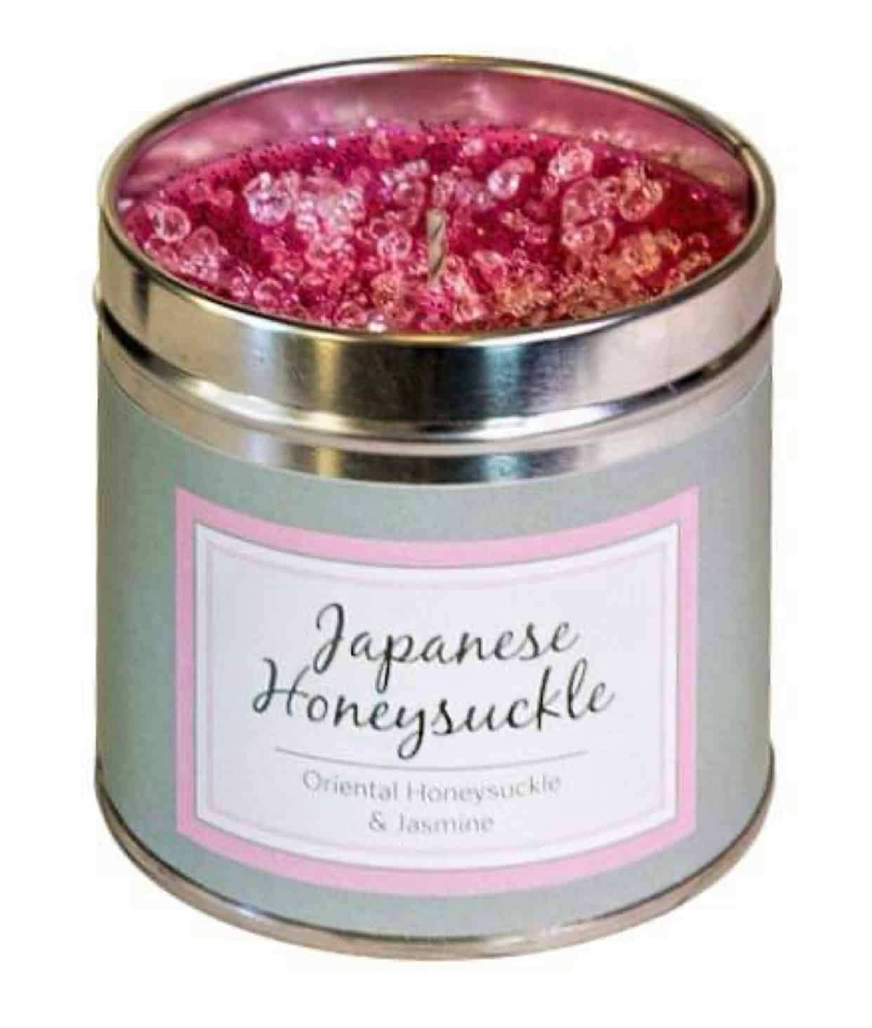 Japanese Honeysuckle Scented Candle with floral crystals and pink hue.