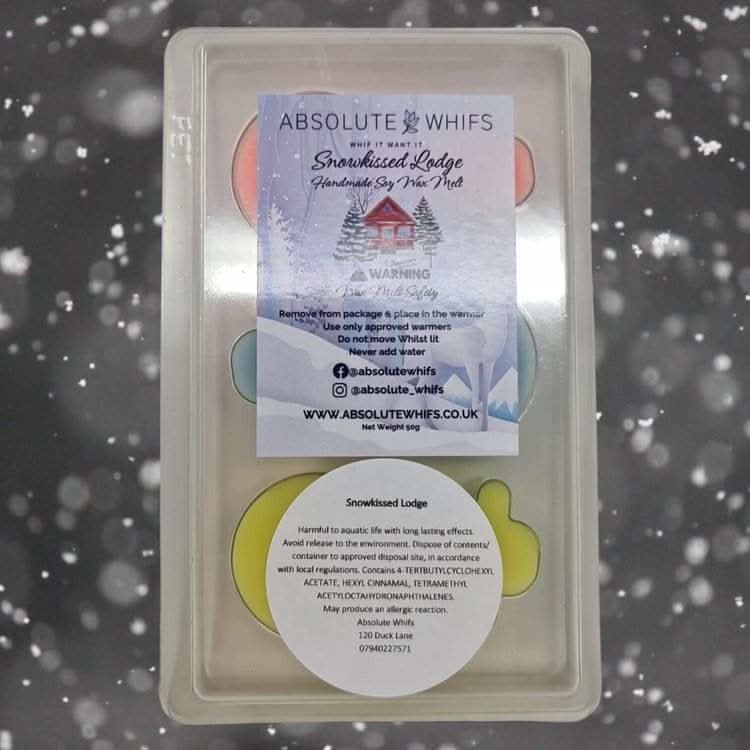 Snowmen scented wax melts with festive aromas in packaging.