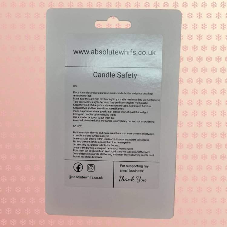 Back of package for unscented tea lights with safety instructions and branding.