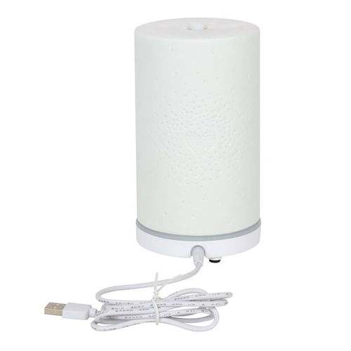 White ceramic electric aroma diffuser with heart pattern and USB cable.