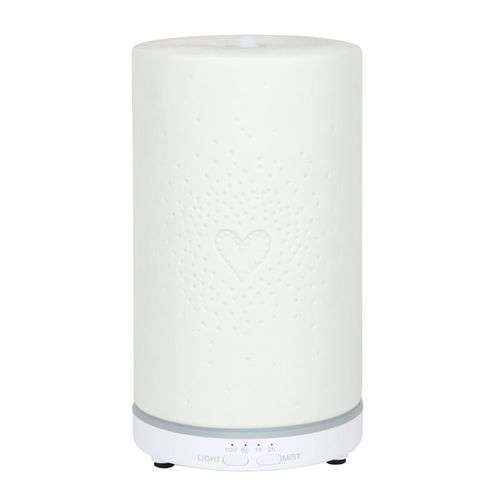 White ceramic heart scatter electric aroma diffuser for essential oils.