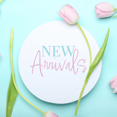 New arrivals round plaque with a blue background and pink tulips