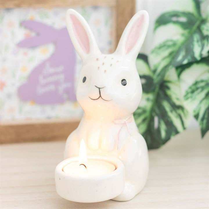 Bunny themed Tealight holder with a easter theme behind 