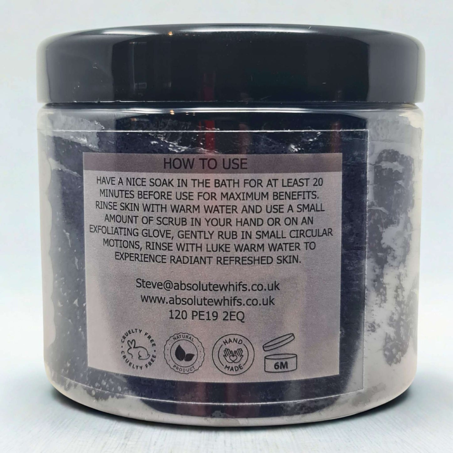 Black Citrus Sugar Body Scrub jar with usage instructions and skincare benefits label