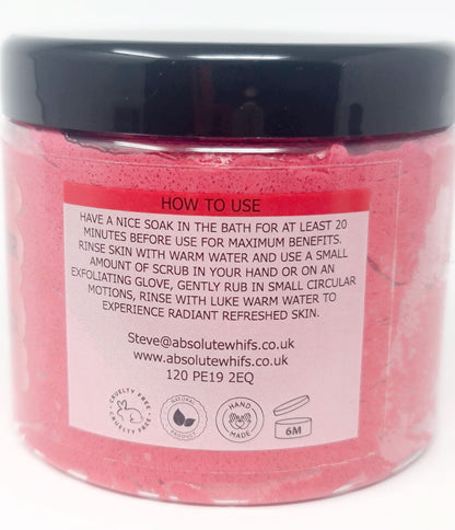 Pomegranate Noir Sugar Body Scrub in clear jar with black lid showing usage instructions and pink texture