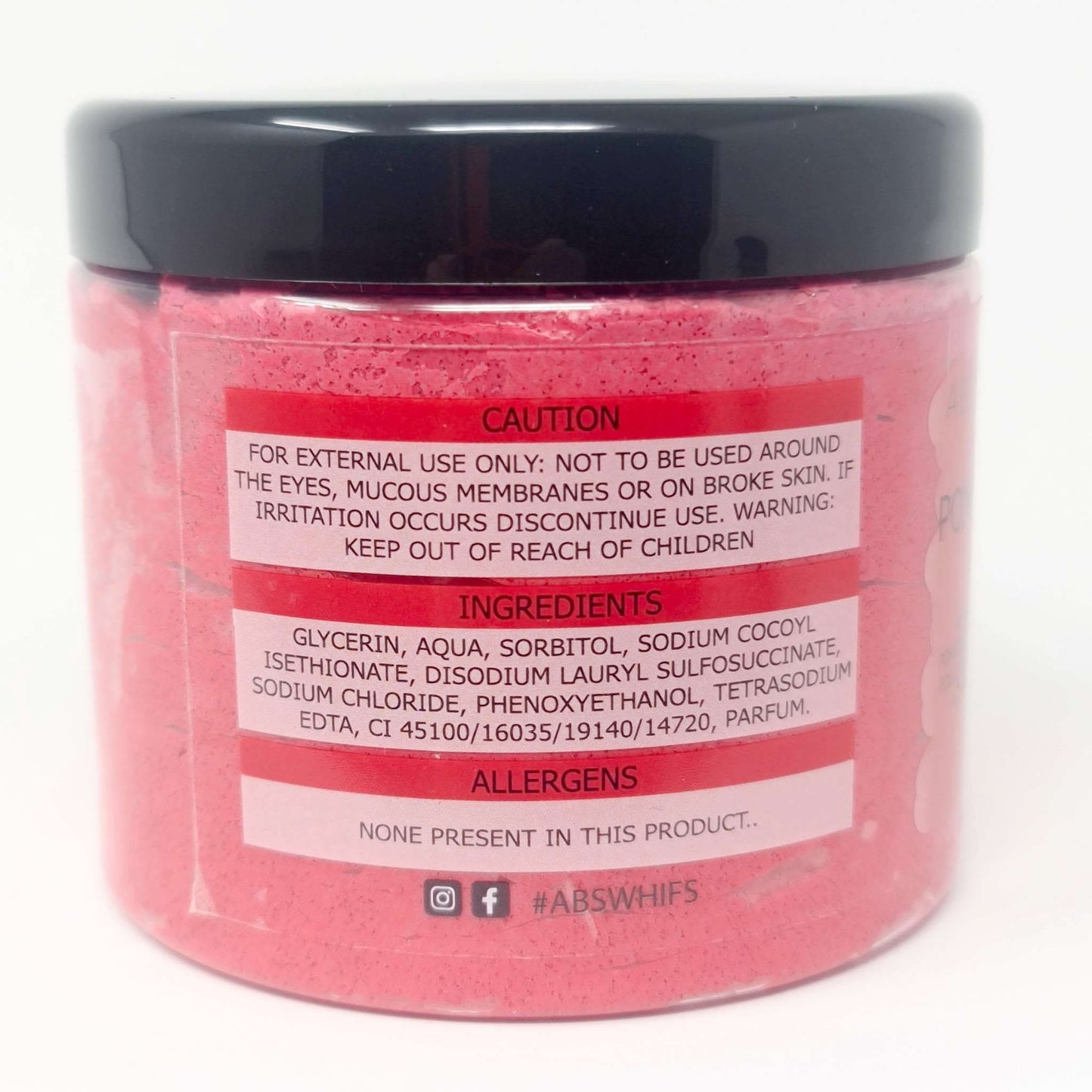 Pomegranate Noir Sugar Body Scrub in pink jar with black lid showing ingredients and caution label