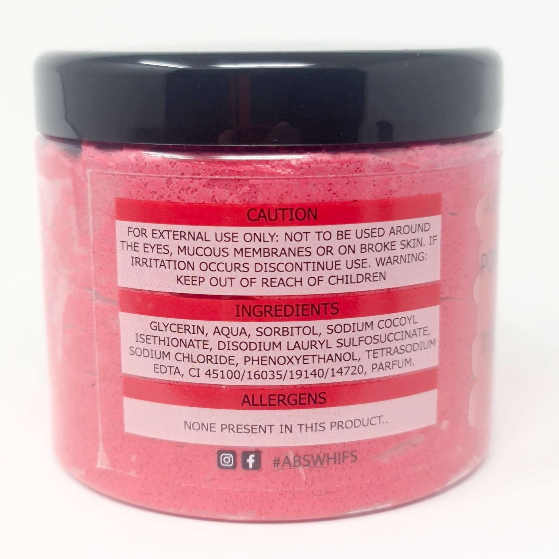 Pomegranate Noir Sugar Body Scrub in pink jar with black lid showing ingredients and caution label