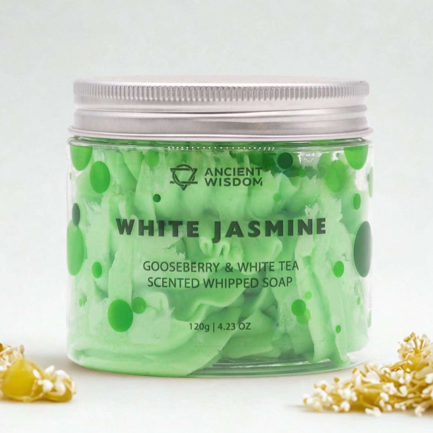 Green whipped soap in a jar with 'Ancient Wisdom' branding on a white background