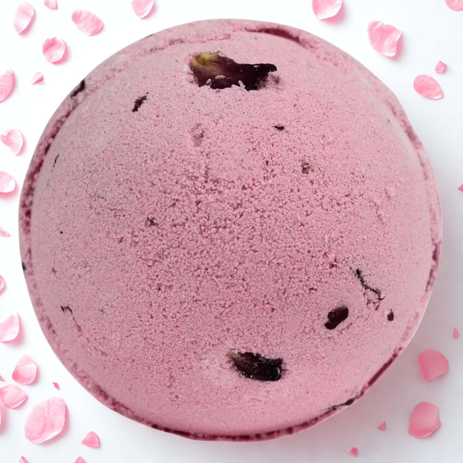 Pink Rose & Petals Bath Bomb surrounded by rose petals for luxurious fragrant bath soak