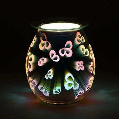 3D Flower Petal Light Up Electric Oil Burner with glowing multicolored illuminated 3D flower petal pattern on black background