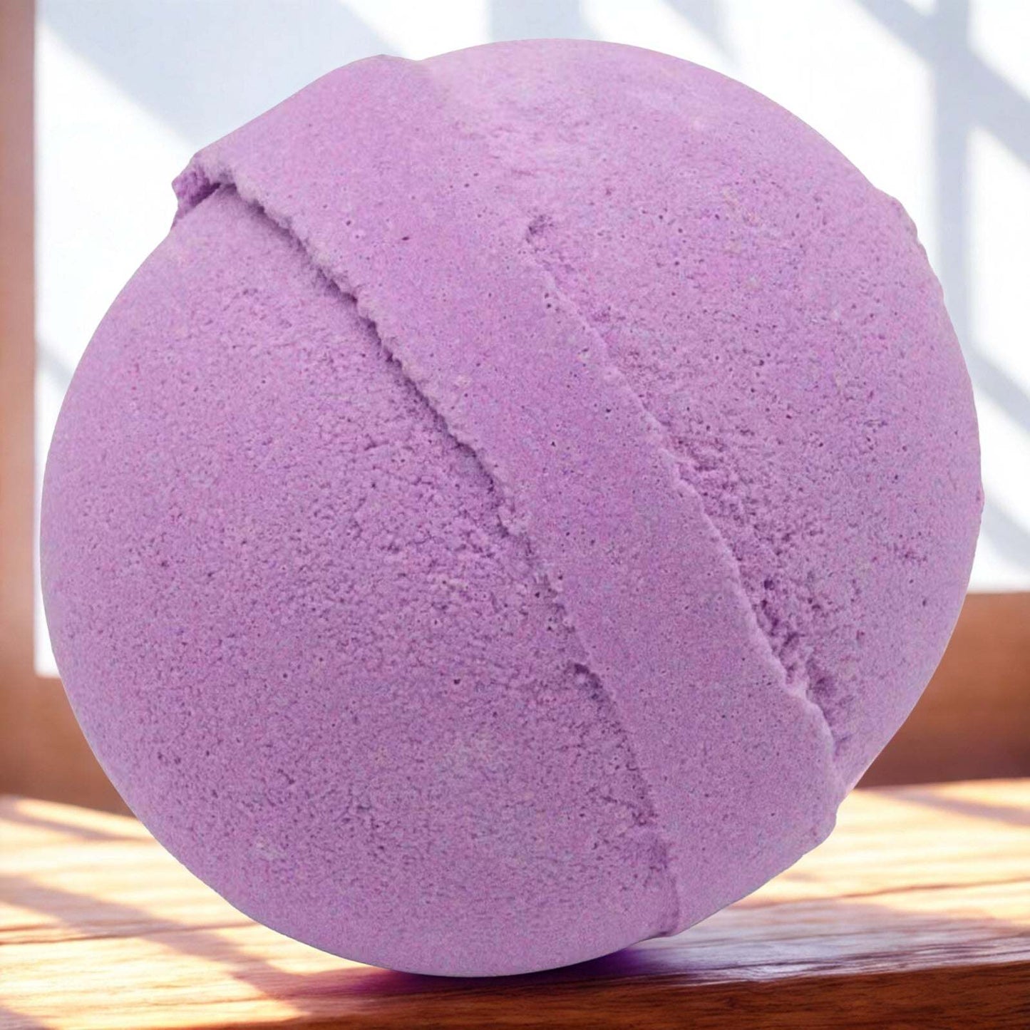 Purple 180g handmade blackberry bath bomb for relaxing and fragrant baths, vegan and UK-made.