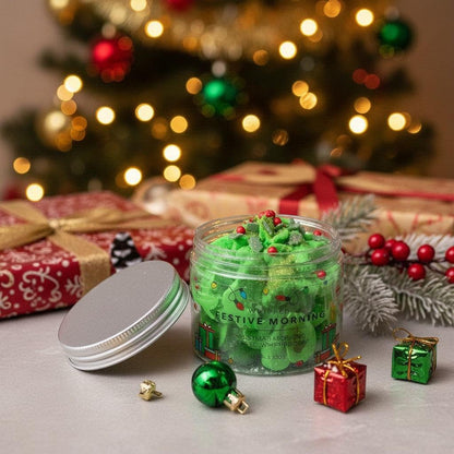 Absolute Whifs Festive Morning whipped soap in a clear jar with a silver lid, set against a blurred Christmas tree.