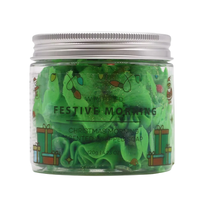Absolute Whifs Festive Morning whipped soap in a clear jar with a silver lid, featuring green soap and holiday decor.