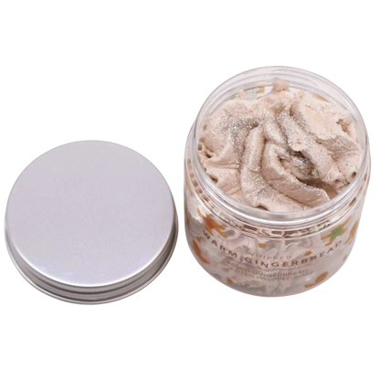 Absolute Whifs Warm Gingerbread whipped soap in a clear jar with a silver lid, featuring a light beige creamy texture.