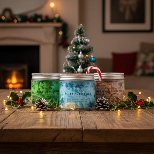 Absolute Whifs holiday whipped soap trio in clear jars with silver lids, displayed on a wooden table with festive decor