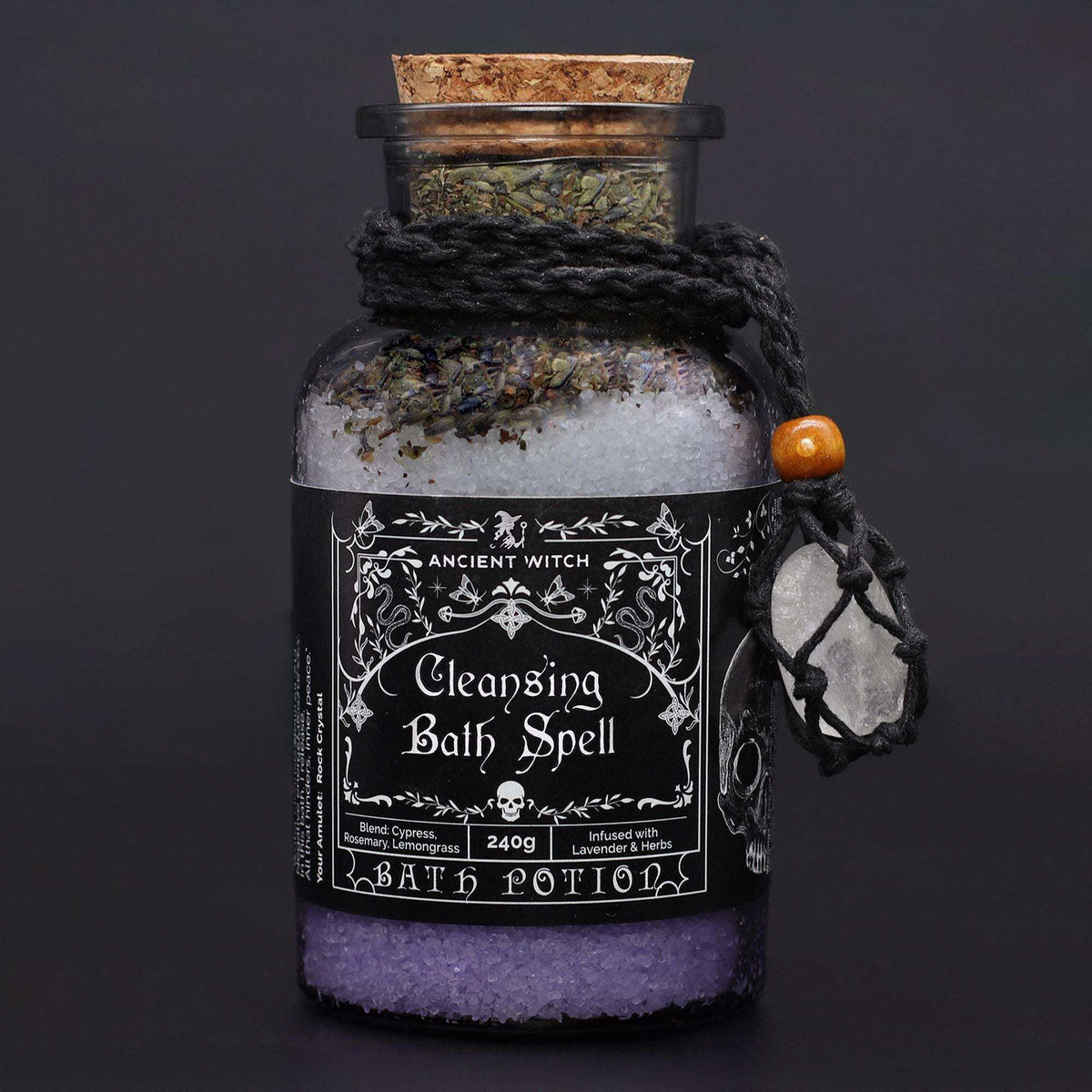 Ancient witch bath spell cleansing potion in apothecary bottle with rock crystal amulet