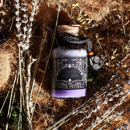 Ancient witch bath spell potion in glass bottle with rock crystal amulet on black cord