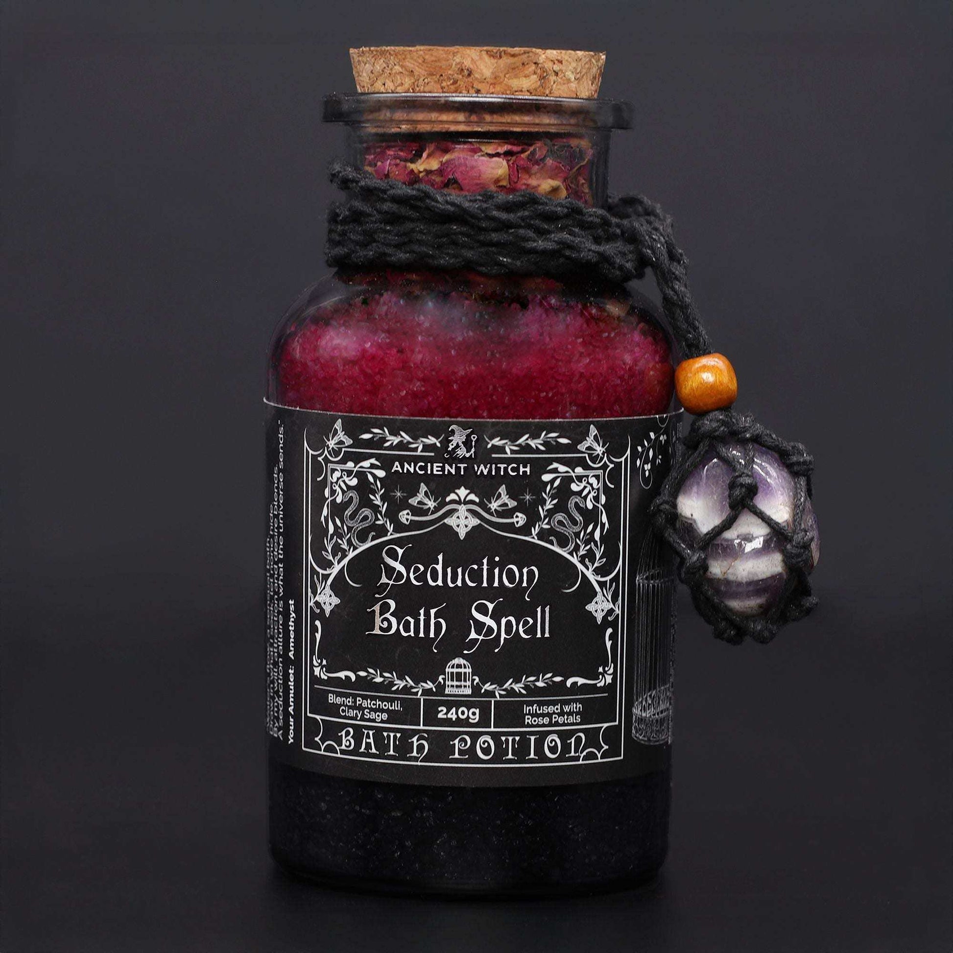 Ancient witch bath spell jar with amethyst amulet and rose petals for seduction ritual