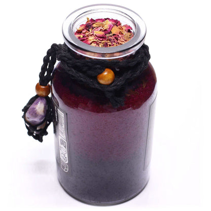 Ancient witch bath spell jar with amethyst crystal amulet and rose petals for seduction ritual