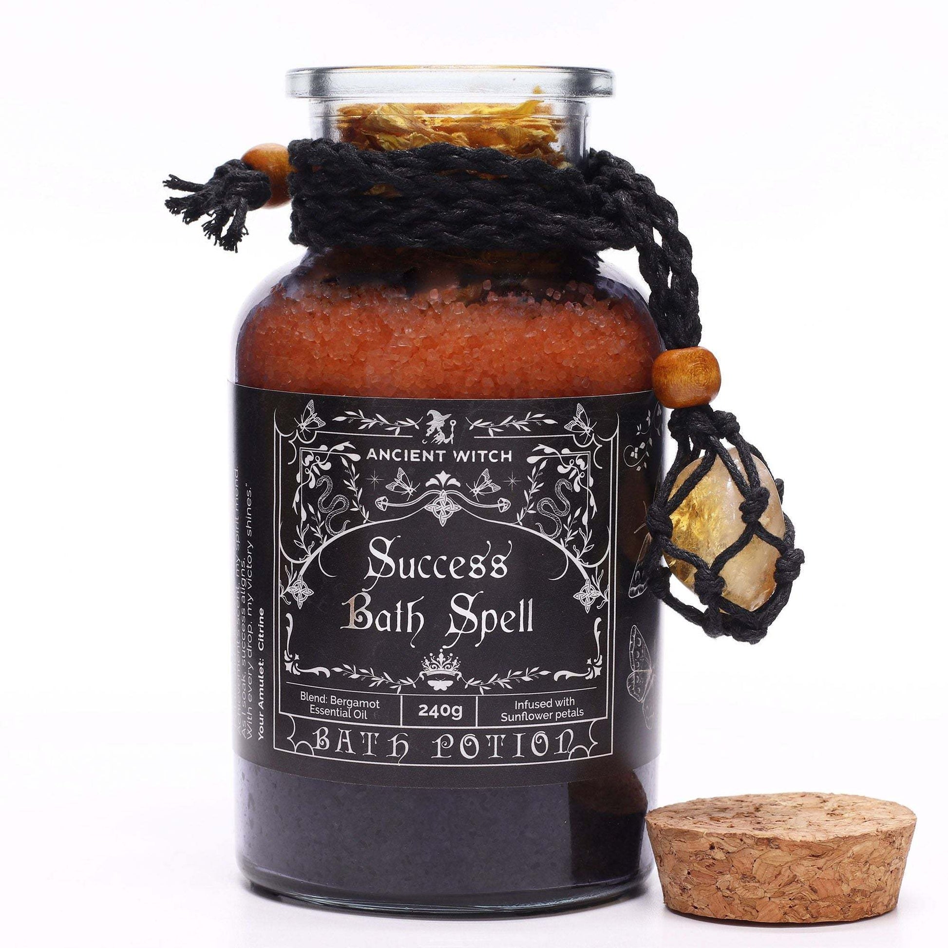 Ancient witch bath spell with success potion and citrine crystal amulet