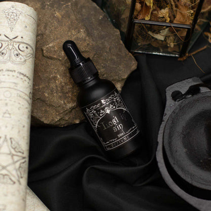 Ancient Witch Perfume Oil - Lost in Sin bottle with musky and floral scent
