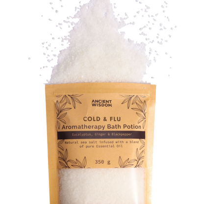Aromatherapy Bath Potion - Colds & Flu in a kraft paper bag with white mineral-rich sea salt spilled above, featuring eucalyptus, ginger, and black pepper essential oils