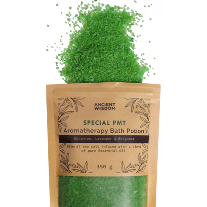 Aromatherapy Bath Potion - PMT green coarse sea salt crystals spilling from a 350g kraft paper bag with botanical design and essential oil blend label