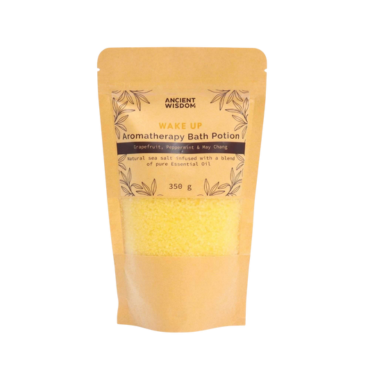 Aromatherapy Bath Potion - Wake Up in a kraft bag containing yellow sea salt infused with grapefruit, peppermint, and may chang essential oils